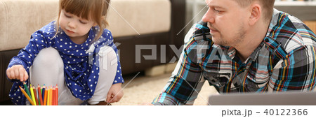 Blond smiling little girl hold in arm pencil 40122366