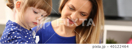 Blond smiling little girl hold in arm brush Blond smiling little girl hold in arm brush 40122464