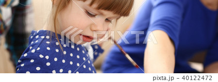 Blond smiling little girl hold in arm brush Blond smiling little girl hold in arm brush 40122472