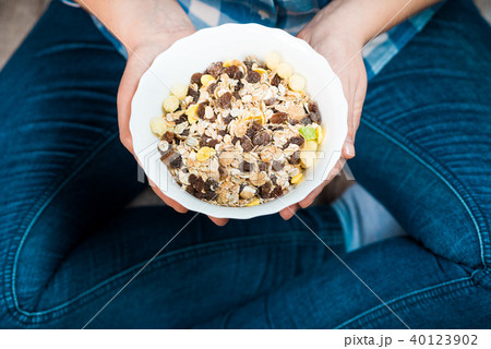 Girl with a plate of muesli 40123902