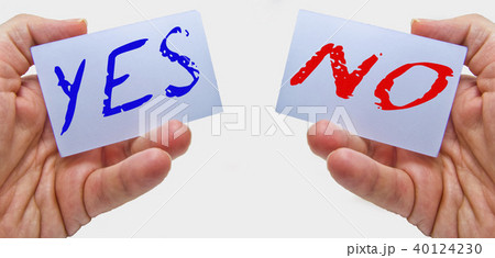businessman showing yes and no cards in his hands businessman showing yes and no cards in his hands 40124230