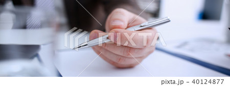 Male arm in suit and tie hold silver pen Male arm in suit and tie hold silver pen 40124877