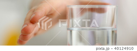 Male arm stretching out to glass 40124910