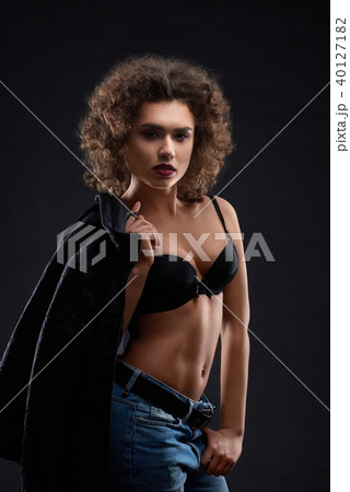 Sexy woman in black bra and blue jeans. Sexy woman in black bra and blue jeans. 40127182