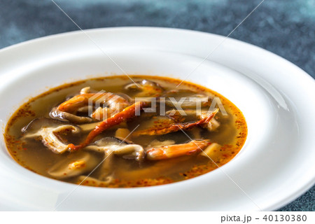 Portion of thai tom yum soup Portion of thai tom yum soup 40130380