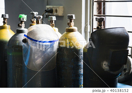 gas cylinders and protection mask in workshop gas cylinders and protection mask in workshop 40138152