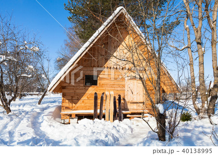 view of little timber cottage and wide skis 40138995