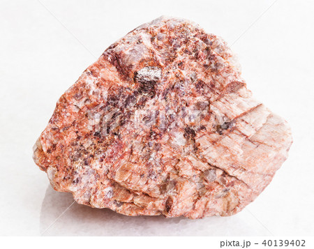 piece of pink Granite stone on white marble 40139402