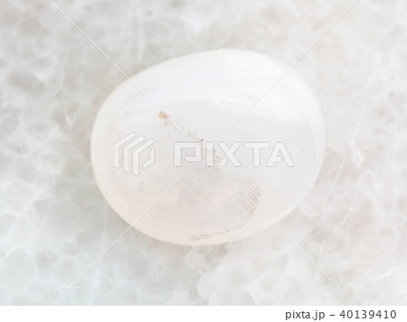 polished milky quartz gemstone on white marble polished milky quartz gemstone on white marble 40139410