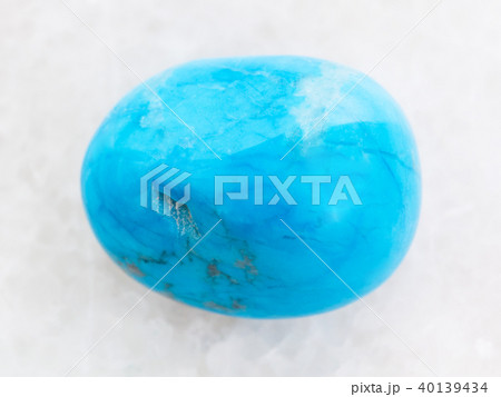 polished Turquenite (blue howlite) stone on white 40139434