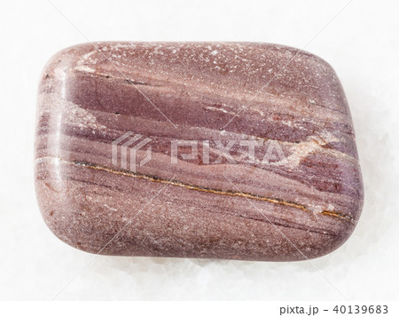 polished Argillite gemstone on white marble 40139683