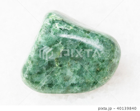polished green Jadeite gemstone on white polished green Jadeite gemstone on white 40139840