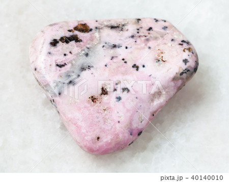 tumbled rhodochrosite gem on white 40140010