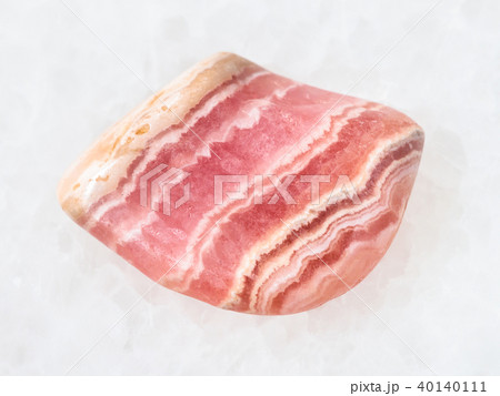 polished rhodochrosite gem stone on white 40140111