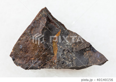 raw tagamite stone on white 40140156