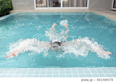 young man swims up to the termination of a path an 40148479