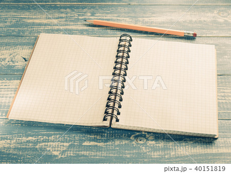 checked notebook on wood 40151819