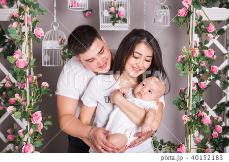 Indoor portrait of asian mixed race family with infant baby 40152183