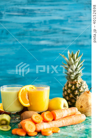 Detox juices next to fruits and vegetables Detox juices next to fruits and vegetables 40152698
