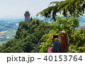 Tourists take pictures of the castle of San Marino 40153764