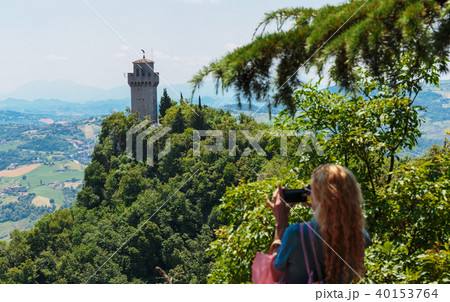 Tourists take pictures of the castle of San Marino 40153764