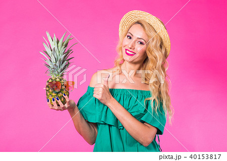 Portrait of happy woman and pineapple over pink background. Summer, diet and healthy lifestyle 40153817