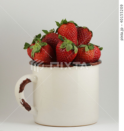 strawberry in a mug on white 40155209