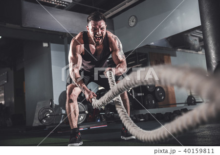 Men with rope in functional training fitness 40159811