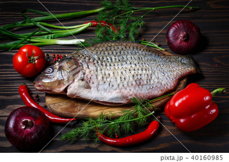 Carp fish with fresh vegetables 40160985