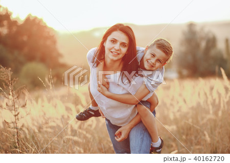 mom and son hugging 40162720