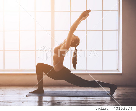 Young woman doing yoga 40163574