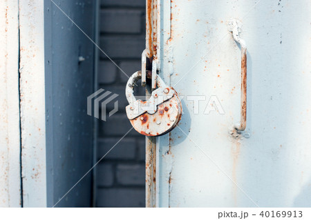 closeup metal door with lock, grungy style closeup metal door with lock, grungy style 40169913