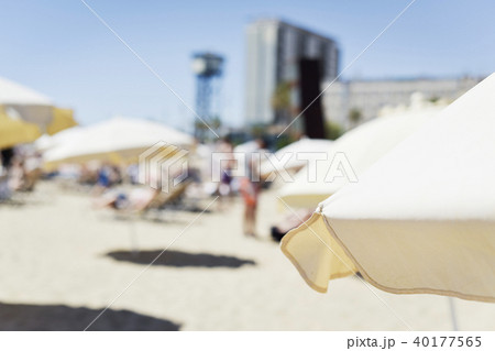 relaxing at Barceloneta beach in Barcelona, Spain. 40177565