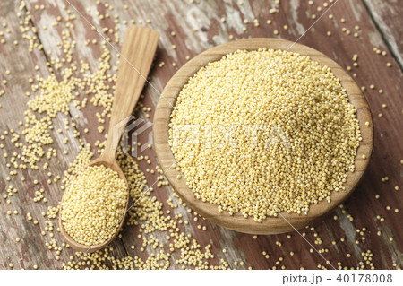 millet cereal in a wooden plate 40178008