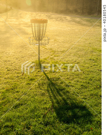 Disc golf hole basket in autumn park 40180545