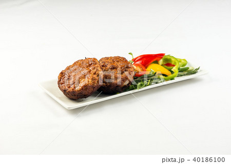 Fried cutlets and vegetable salad white plate on white background Fried cutlets and vegetable salad white plate on white background 40186100