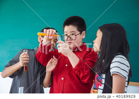 school children doing chemistry experiment school children doing chemistry experiment 40189929