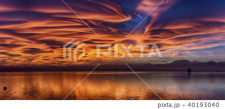 Amazing lenticular clouds at the sunset 40193040