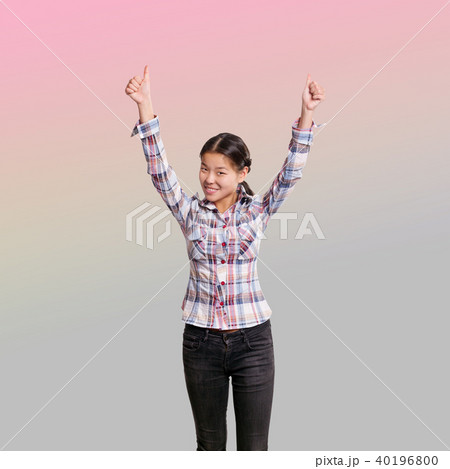 Winning concept. Asian girl shows well done Winning concept. Asian girl shows well done 40196800