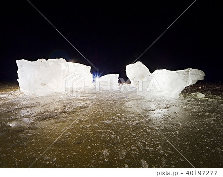 Blue ice cubes shine on flat glacier surface. Blue ice cubes shine on flat glacier surface. 40197277