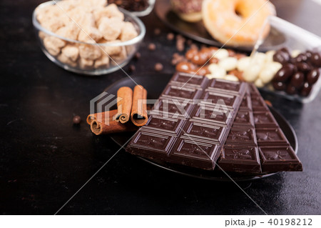 Candies and donuts next to other sweets 40198212