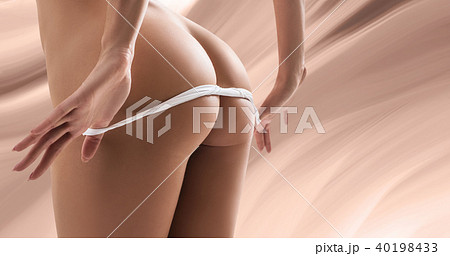 Sexy beautiful woman taking off her white panties. - Stock Photo