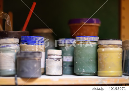 cans of paint on the shelf in the workshop cans of paint on the shelf in the workshop 40198971