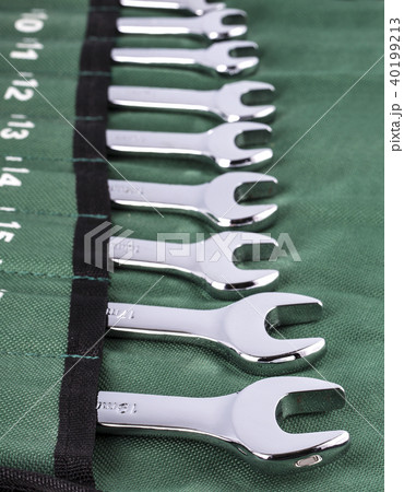 Open-end wrench set on green cover. Open-end wrench set on green cover. 40199213