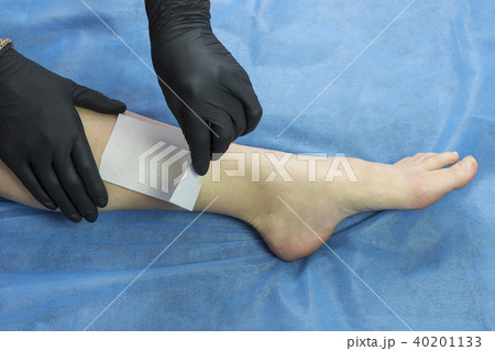 Process depilation female legs and hands in a beau Process depilation female legs and hands in a beau 40201133