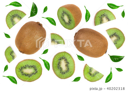 sliced kiwi fruit decorated with green leaves isolated on white background. Flat lay pattern. Top sliced kiwi fruit decorated with green leaves isolated on white background. Flat lay pattern. Top 40202318