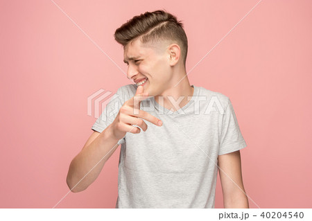 The happy business man point you and want you, half length closeup portrait on pink background. 40204540
