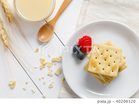 crackers with condensed milk and fruit, breakfast crackers with condensed milk and fruit, breakfast 40206320