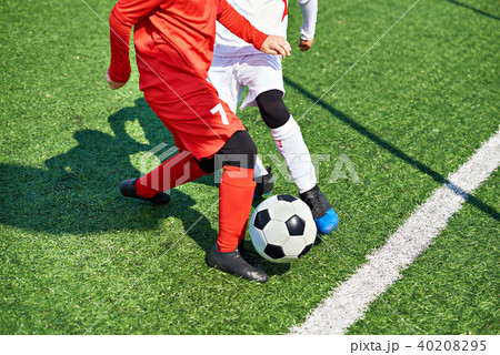Child soccer players and ball on football field Child soccer players and ball on football field 40208295