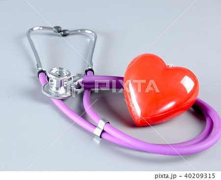 stethoscope and Red heart on white background. Selective focus. stethoscope and Red heart on white background. Selective focus. 40209315